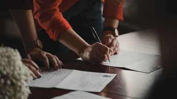Signing paperwork image
